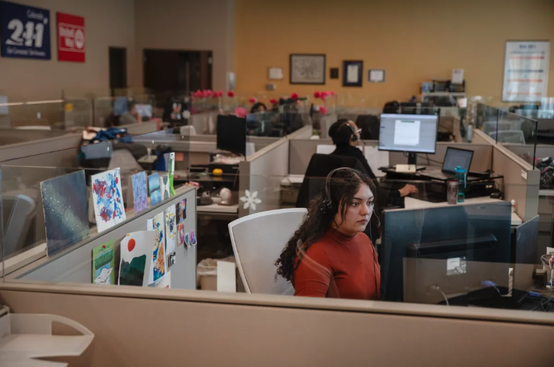 211 Navigator Takes a Phone Call At Her Desk