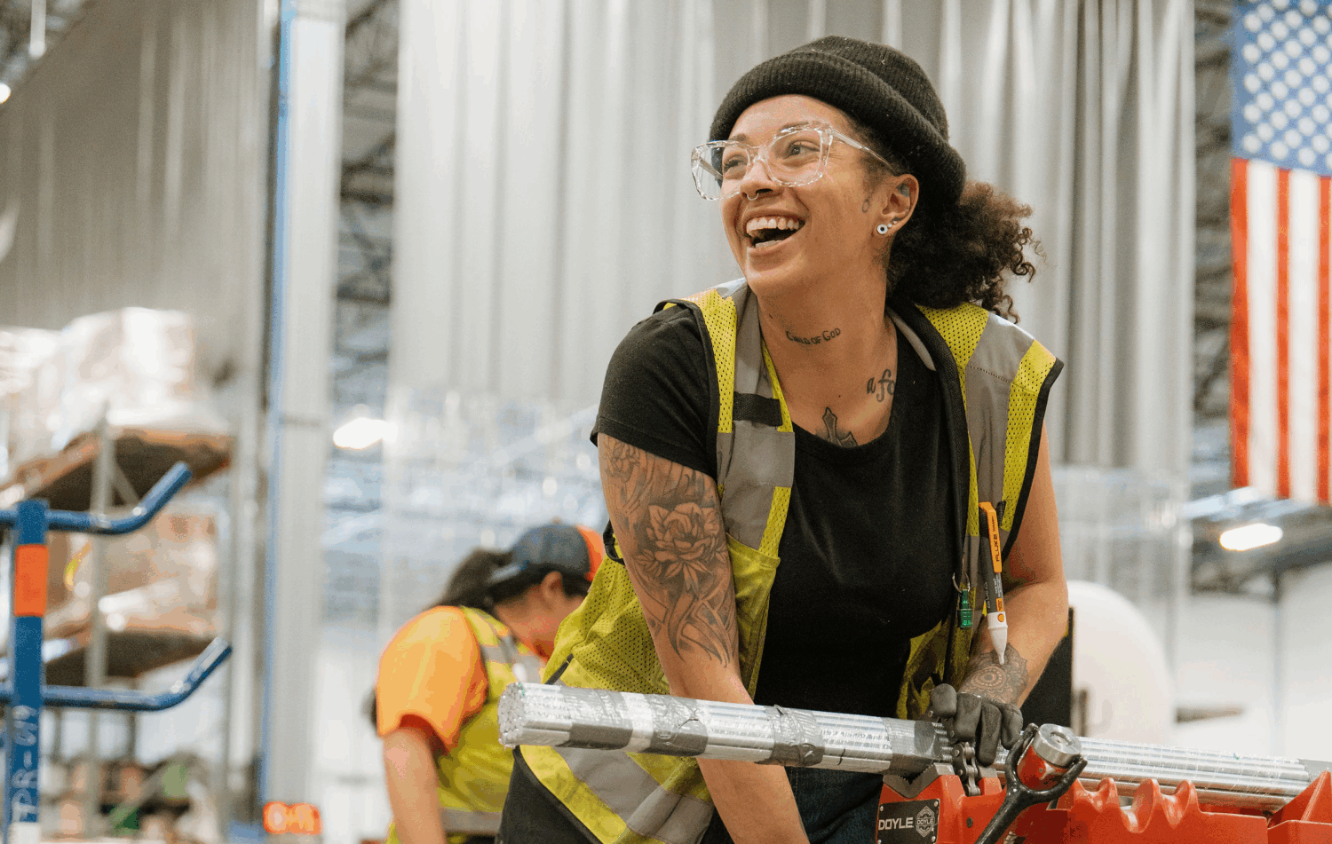 An electrician happily works in the shop