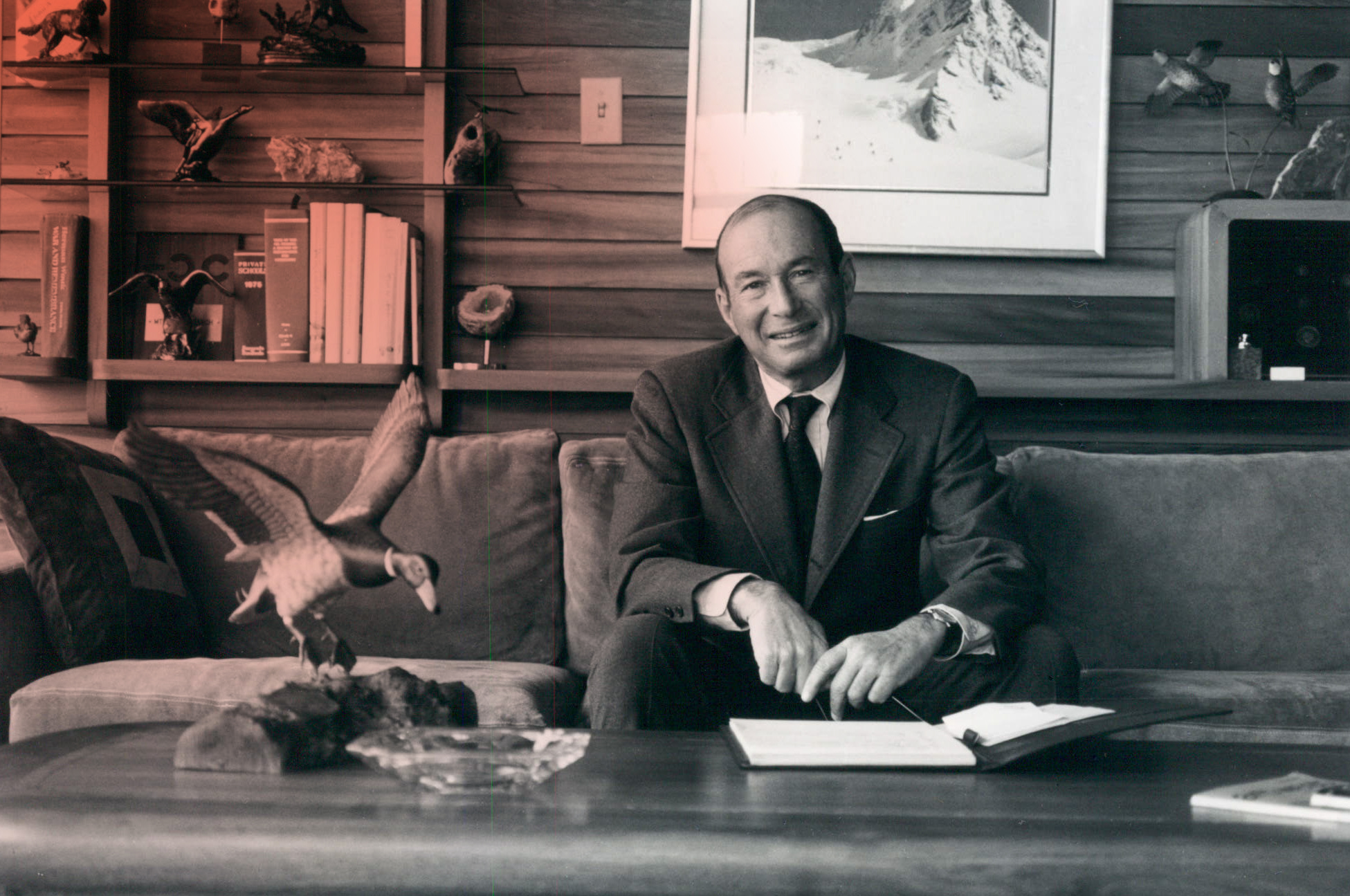 Photo of Sam Gary, smiling at camera, with a sepia and black and white filter over the image