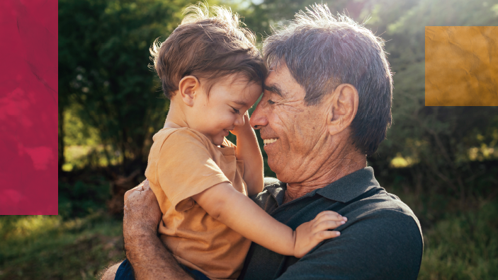 grandpa hugs his grandson